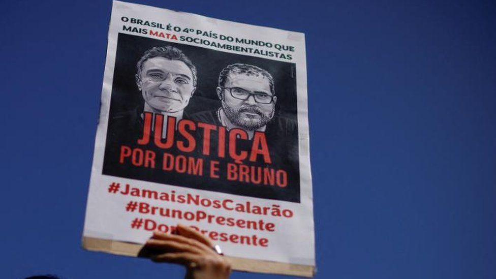 A demonstrator holds a sign during a protest, to demand justice for journalist Dom Phillips and indigenous expert Bruno Pereira, who were murdered in the Amazon, in Brasilia, Brazil June 19, 2022.