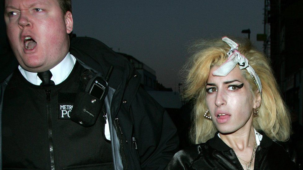 Amy Winehouse and a police officer