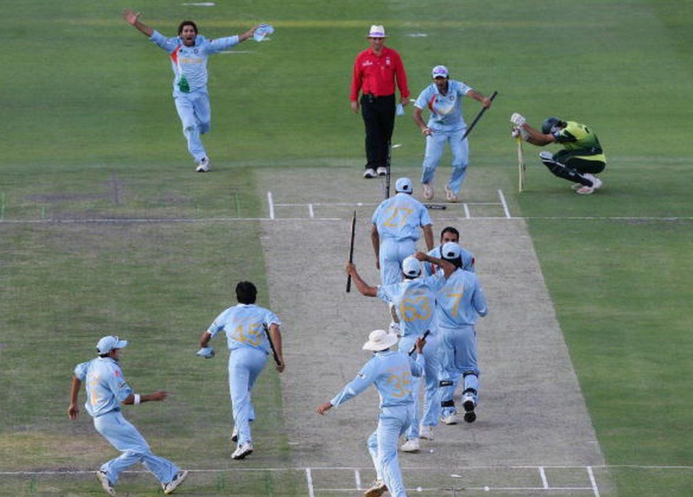 The Indian Team celebrate their win with Misbah-ul-Haq looking on after the Twenty20 Championship Final match between Pakistan and India at The Wanderers Stadium on September 24, 2007 in Johannesburg, South Africa