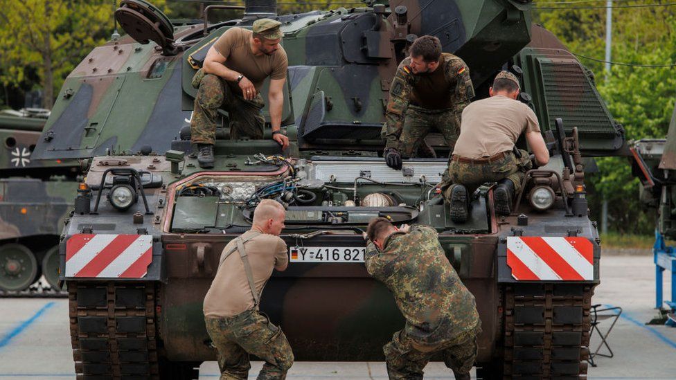 Mechanic soldiers of the Bundeswehr, the German armed forces are seen as they service a Panzerhaubitze 2000