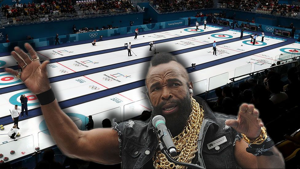 Mr T with curling behind him