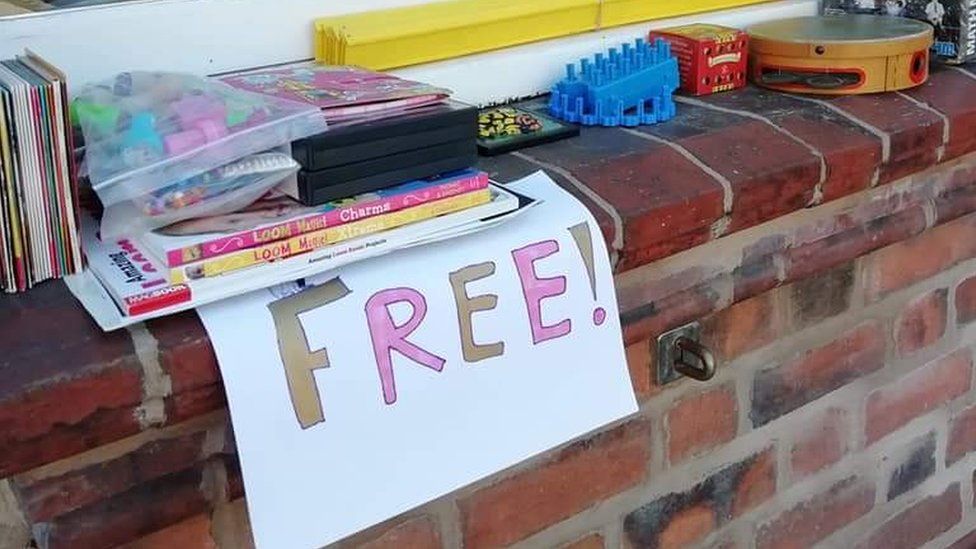 books, sign saying "free!" and a few games