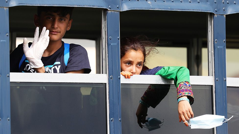 Young Afghan evacuees arrive in a bus after their arrival to Ramstein Air Base in Germany - 26 August 2021