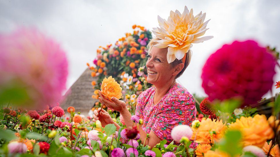 Andie McDowell in a flower arrangement