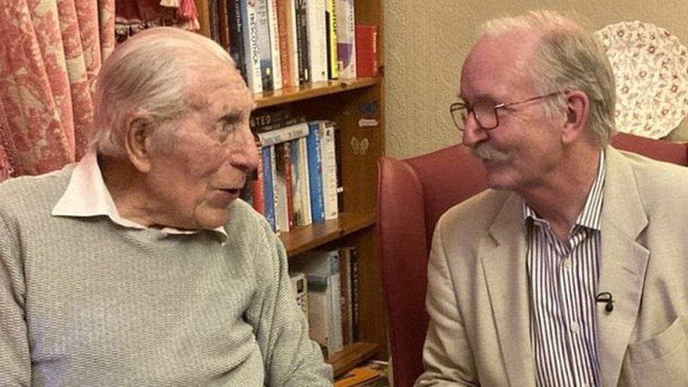 Bob Angles sitting next to Sir George White