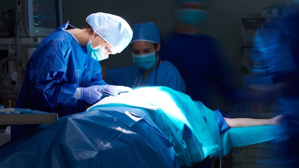 Surgeon performing operation