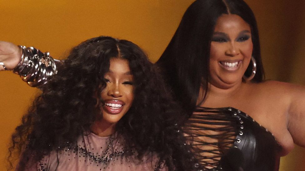 SZA (left) and Lizzo at the Grammys