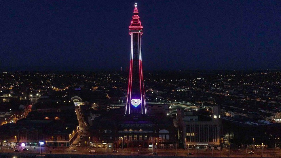 Blackpool Tower lit in red and white stripes