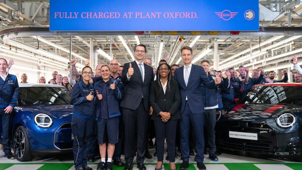 Trade Secretary Kemi Badenoch (centre) with Dr Milan Nedeljkovic, member of the board of management of BMW AG (left) and Markus Gruneisl, CEO of BMW (UK) Manufacturing, at the Mini plant at Cowley in Oxford