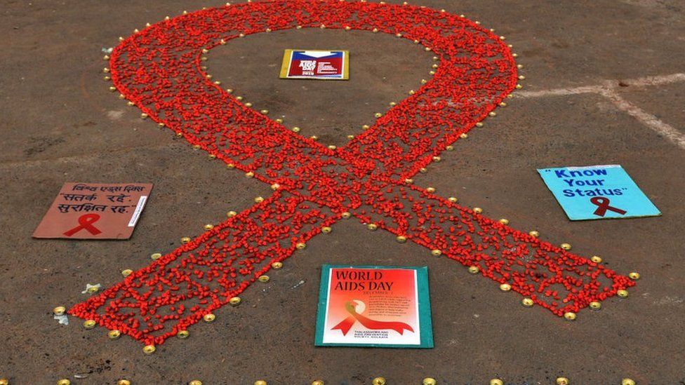 A red ribbon mural during an awareness campaign on AIDS, at Baje Kadamtala Ghat, on December 1, 2019 in Kolkata, India.