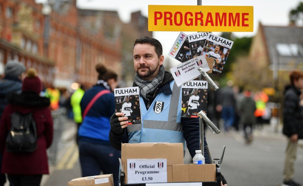 A Fulham FC programme seller