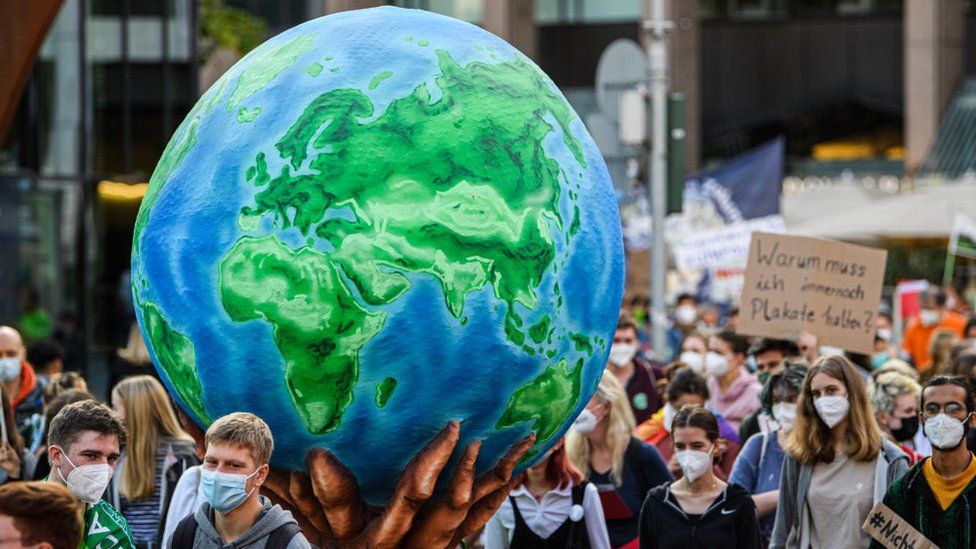 Protesters march to demand aggressive policies towards fighting climate change at a Fridays for Future march on September 24, 2021 in Dusseldorf, Germany.