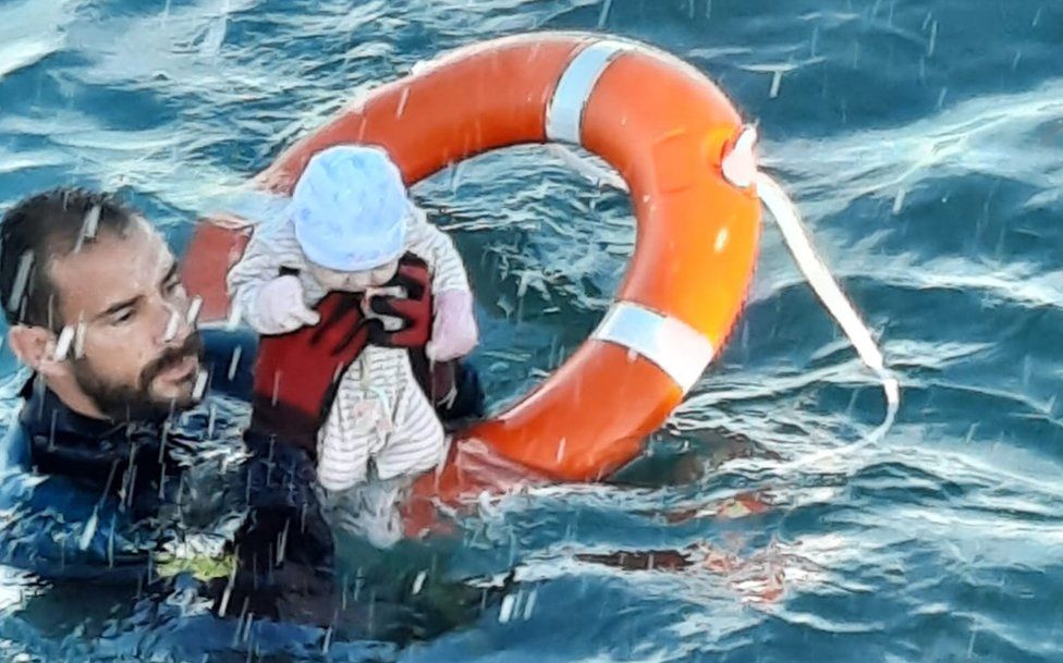 Spain's Guardia Civil posted pictures of a baby and toddlers being rescued from the sea off Ceuta