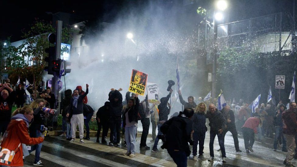 Police use water cannon on protesters in Democracy Square