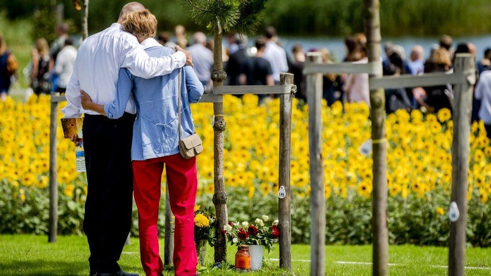 Relatives attend the unveiling of the National Monument for the MH17 victims in Vijfhuizen, on July 17, 2017