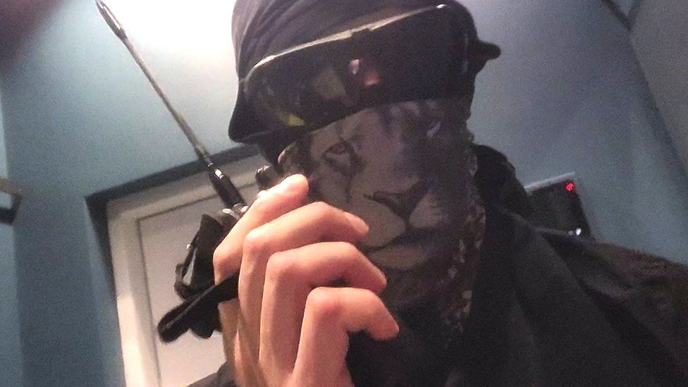 A member of the Squad 303/Anonymous hacker group