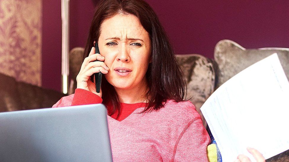 Woman on phone to a call centre