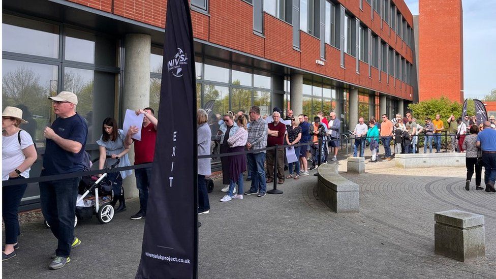 Queue of people outside Kimberley College