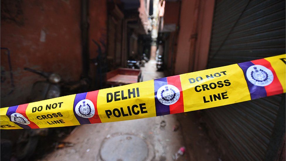 A police barricade tape is seen at the spot where a fire broke out inside a plastic factory killing 43 people, at Anaj Mandi on December 9, 2019 in New Delhi, India.