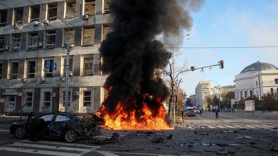 Cars burn after Russian military strike on Kyiv, 10 October 2022