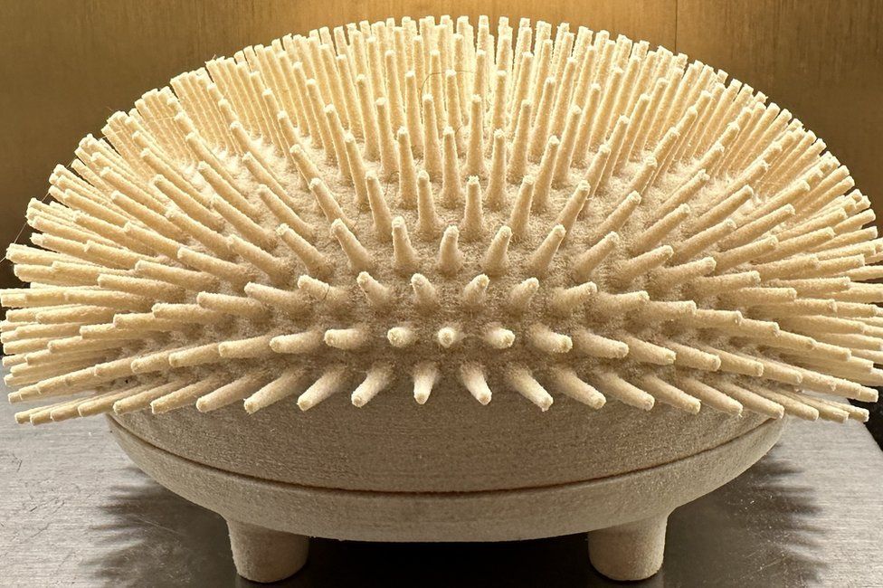 3D printed object shaped like a hedgehog with spines