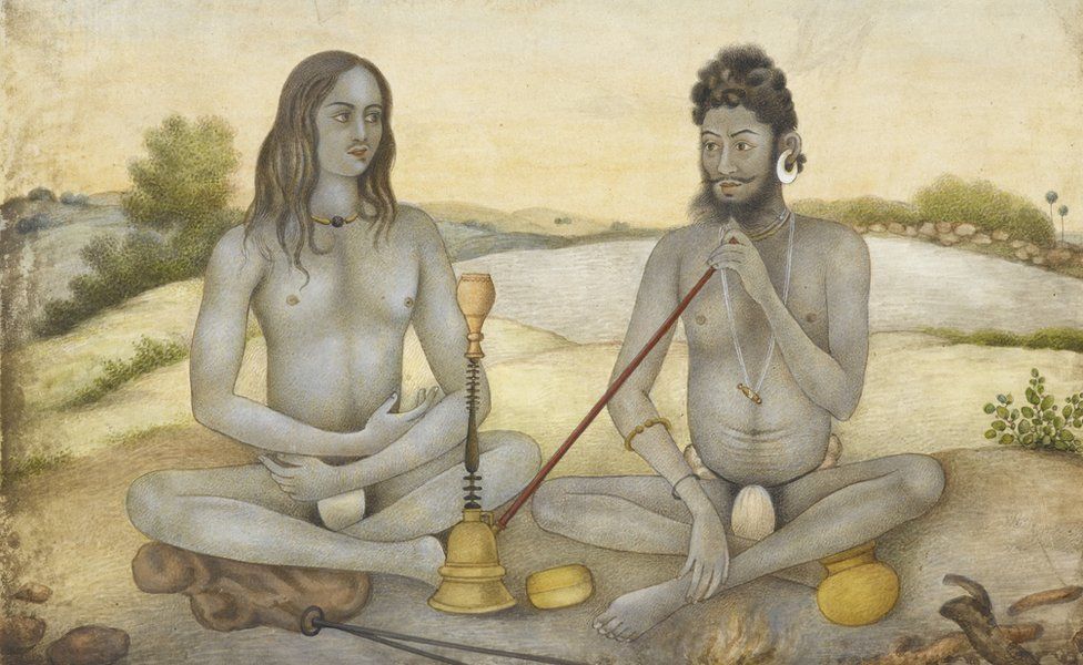 a Saiva ascetic with large earrings and wearing the â€˜lingaâ€™ round his neck, accompanied by his disciple