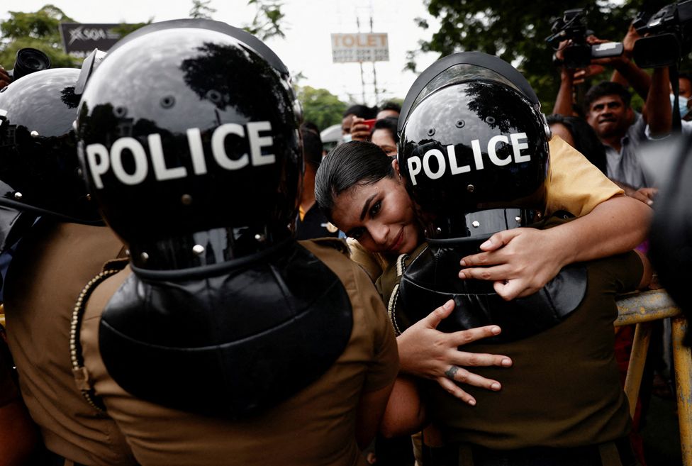 Hirunika Premachandra, a politician and a leader of Samagi Vanitha Balawegaya, a part of the main opposition party Samagi Jana Balawegaya, hugs a female police member during a protest , in Colombo, Sri Lanka. 22 June 2022