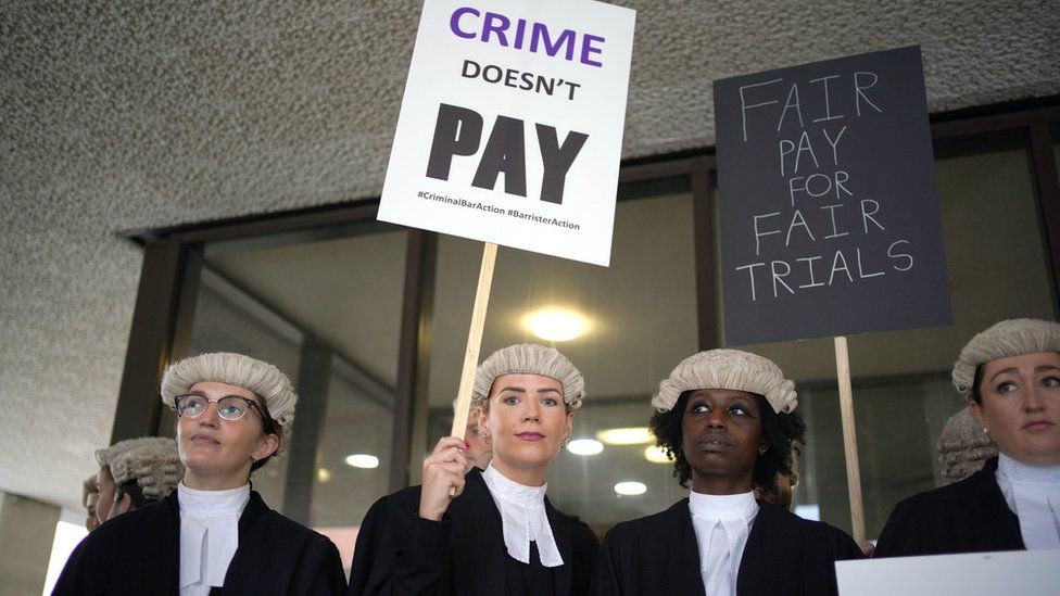 Criminal barristers from the Criminal Bar Association (CBA) demonstrating outside court