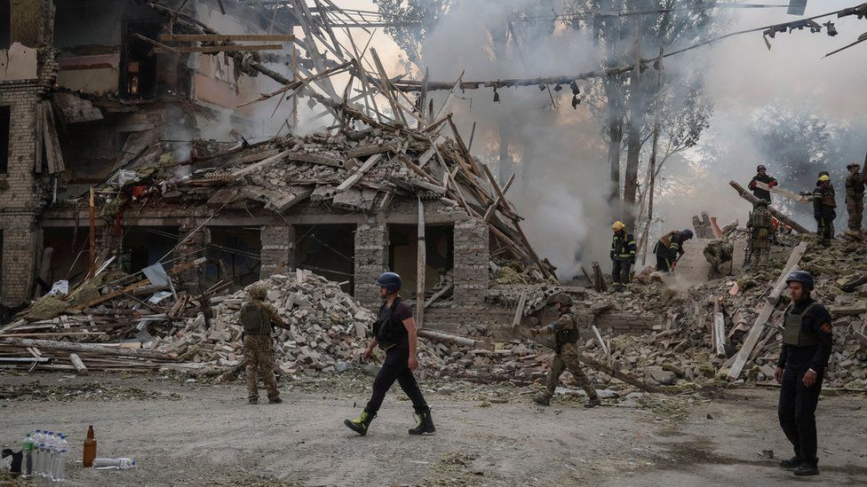 Rescuers and servicemen work at a school building damaged by a Russian military strike, amid Russia"s invasion on Ukraine, in Kramatorsk, in Donetsk region, Ukraine