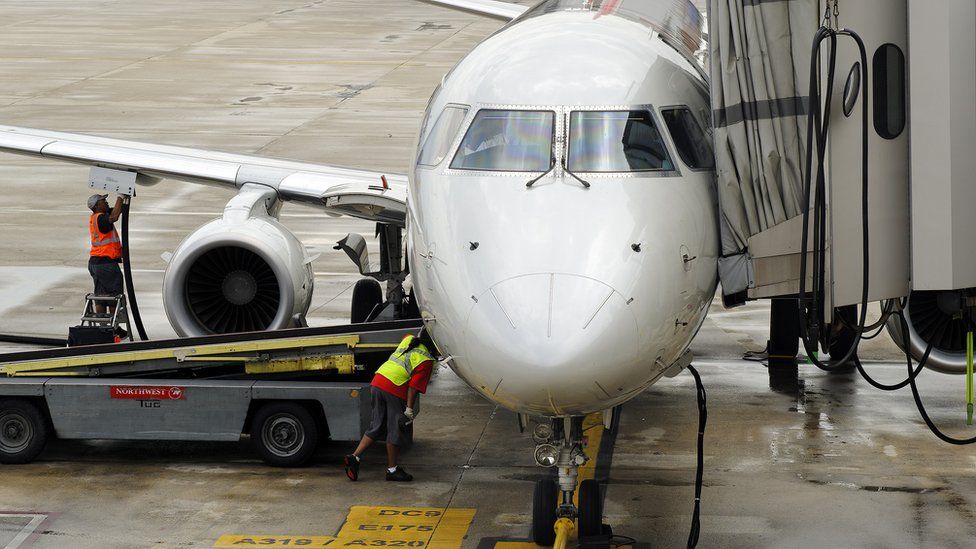 An aeroplane being refuelled at a US airport