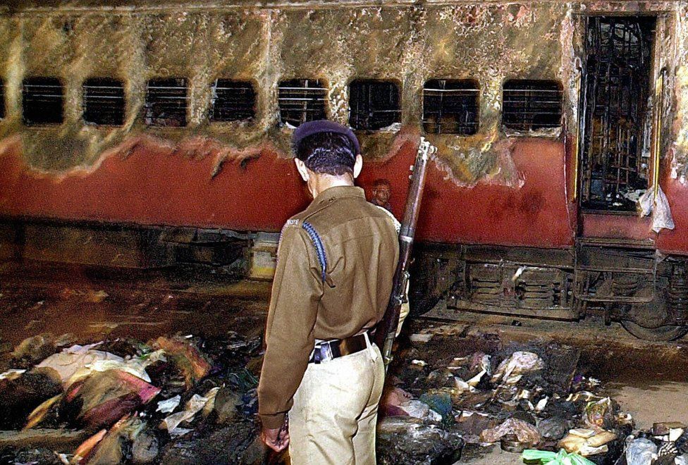 The riots began after a fire on a passenger train in Godhra town killed 60 Hindu pilgrims
