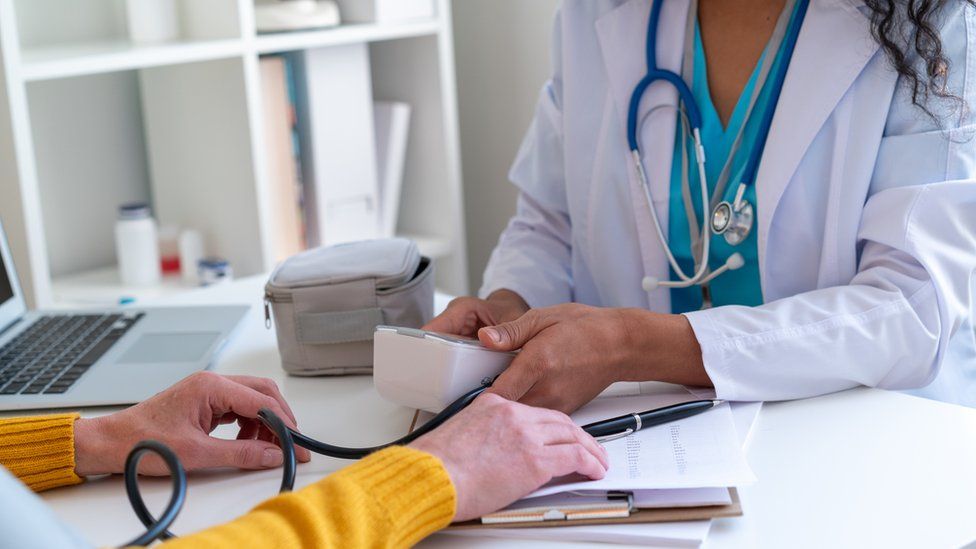 Doctor with patient (stock photo)