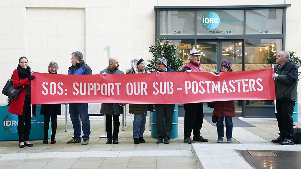 Protestors outside the Post Office Horizon IT inquiry at the International Dispute Resolution Centre, London, ahead of the one-day hearing on issues relating to compensation on 8 December2022