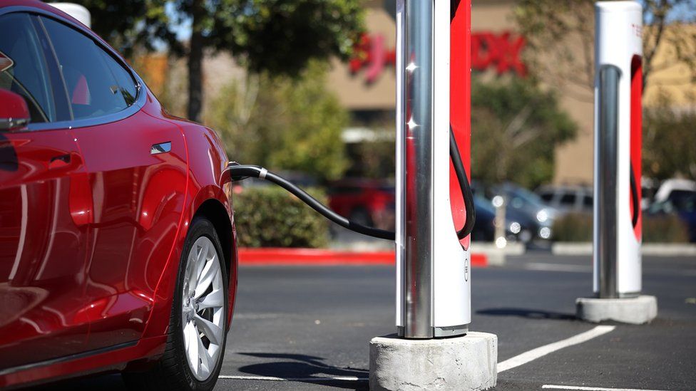 A Tesla car sits parked at a Tesla Supercharger on September 23, 2020 in Petaluma, California.