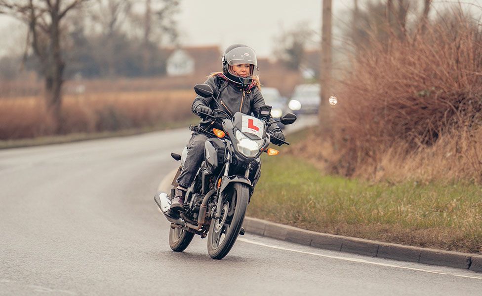 Karina Artun on a motorbike