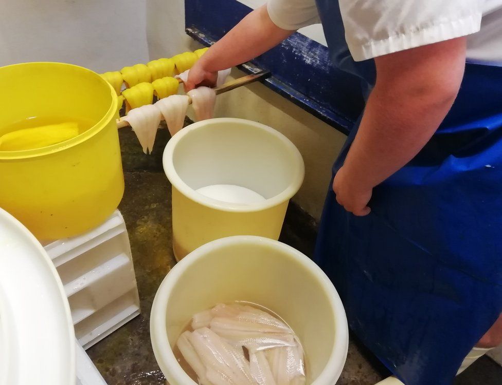 The Portobello fishmonger showing the process of curing