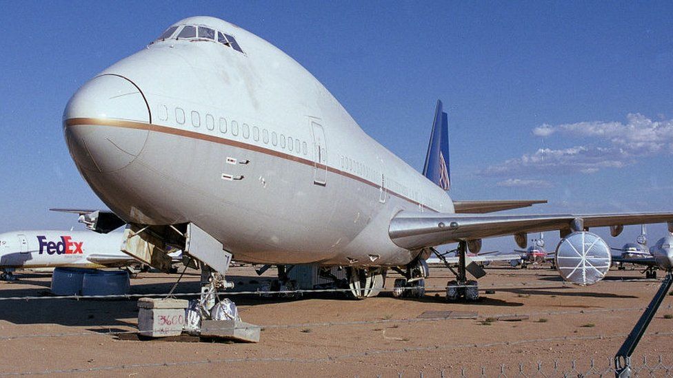 Commercial passenger airplanes and cargo aircraft are stored in the dry desert air at the Mojave Airport