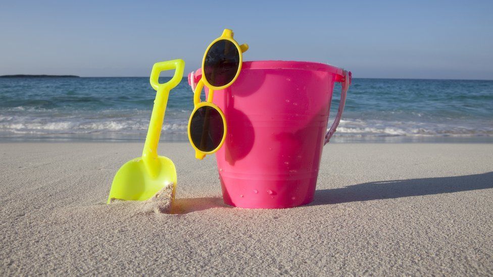 Bucket and spade on a sandy beach