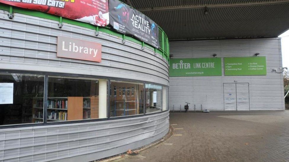West Swindon Library at the Link Centre with metal exterior and a long, low window.