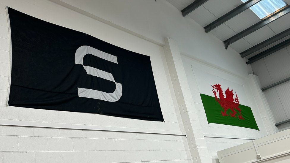 The Space Forge logo next to the Welsh flag