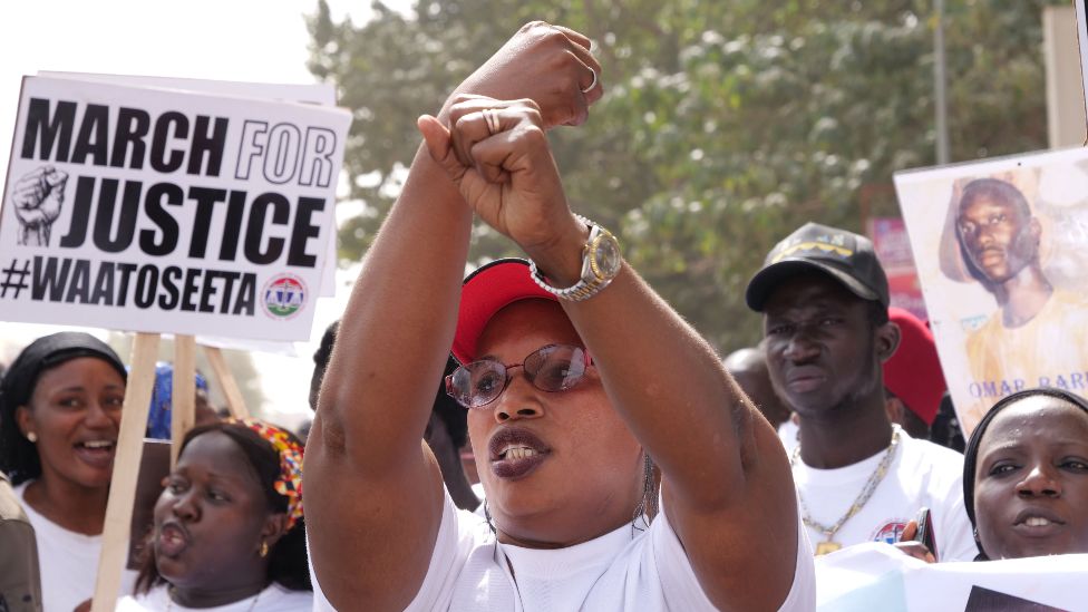 A relative of one of the victims of the regime of Yahya Jammeh gestures during a demonstration asking for the former Gambian president to be brought to justice - Banjul, 25 January 2020