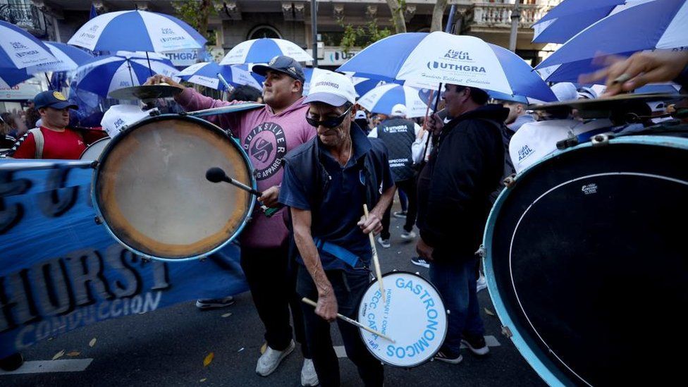 A man plays a drum during protests against university cuts in Buenos Aires.