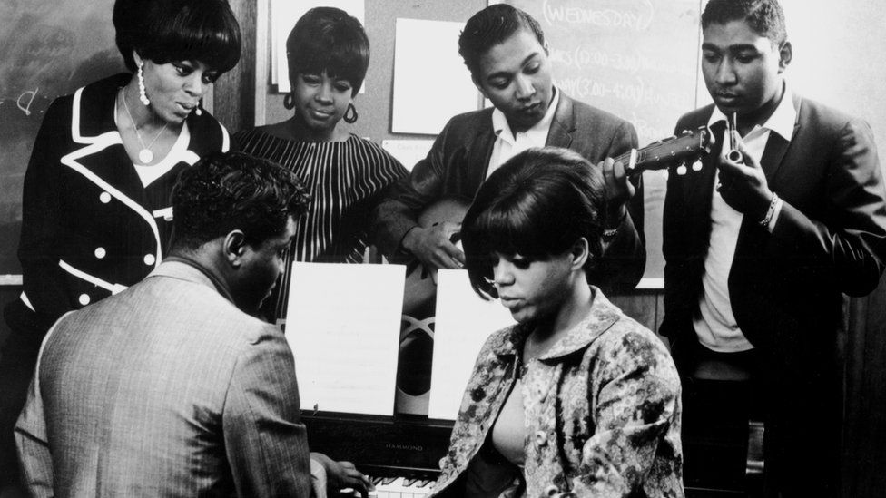 (Left to right) Diana Ross, Lamont Dozier (at piano), Mary Wilson, Eddie Holland, Florence Ballard (seated) and Brian Holland in the Motown studio in Detroit in around 1965