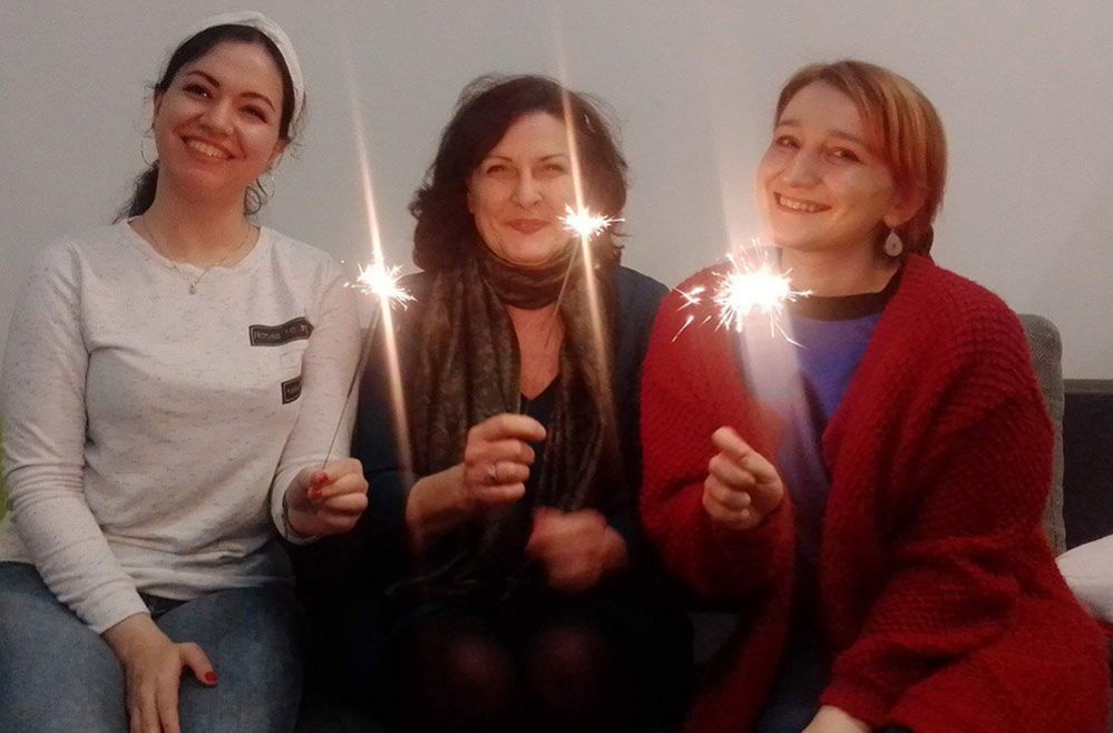 Three women with candles