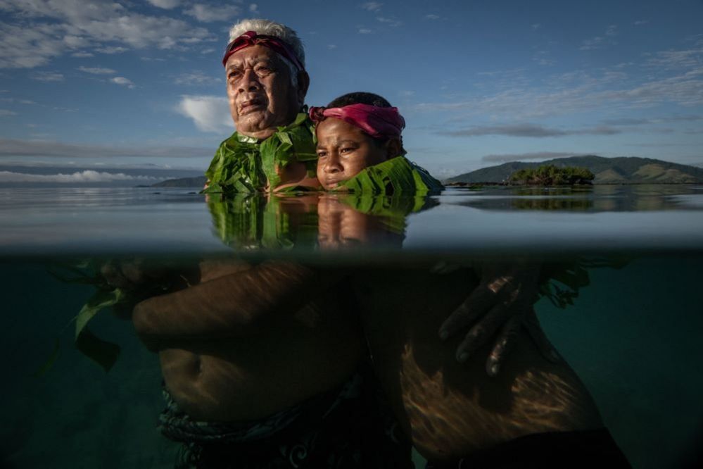 Lotomau Fiafia with his grandson John, Salia Bay, Kioa Island, Fiji, 8 August 2023