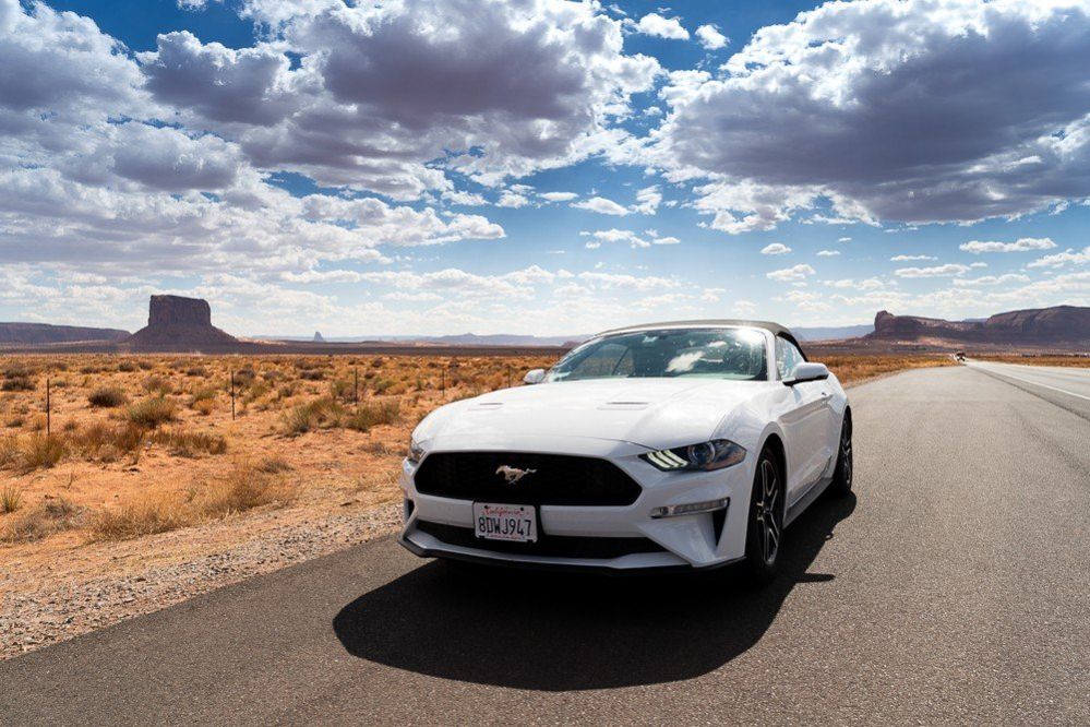 A Ford Mustang car in Monument Valley