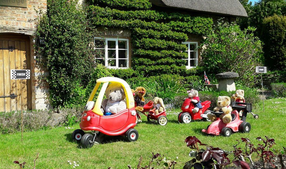 Teddies in toy cars