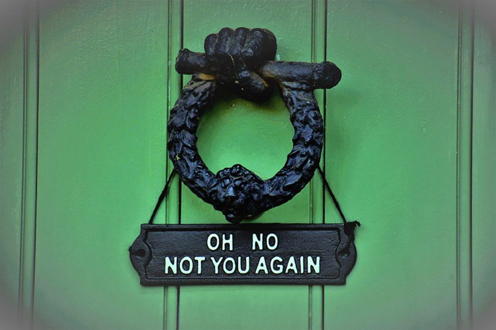 A sign on a front door
