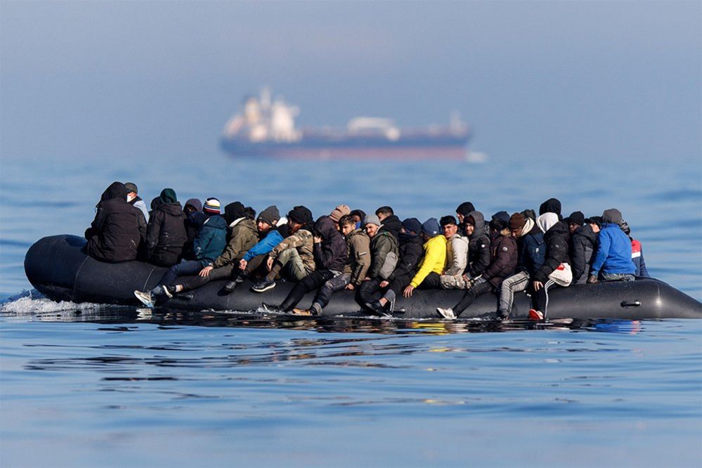 Migrants cross the English Channel on a small boat, March 2024