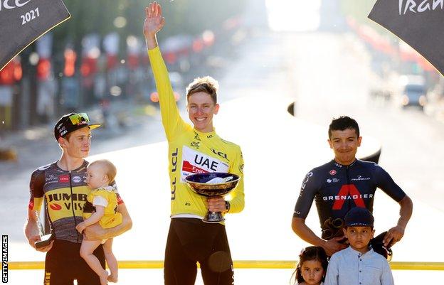 Tadej Pogacar celebrates 2021 Tour de France title